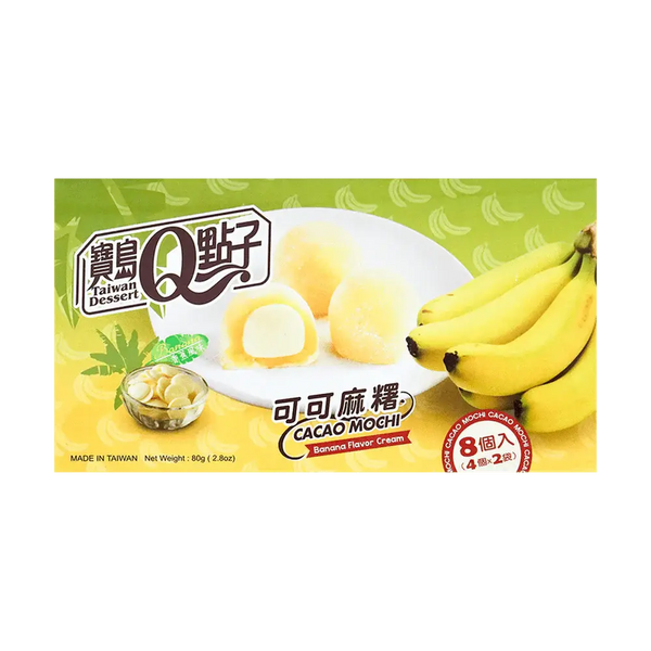 Royal Family Banana Cacao Mochi - Mochis taiwanais moelleux à la banane avec un cœur fondant au chocolat blanc. Un dessert exotique avec un packaging raffiné, entouré de bananes mûres, de chocolat blanc fondu et d’une texture poudrée irrésistible.